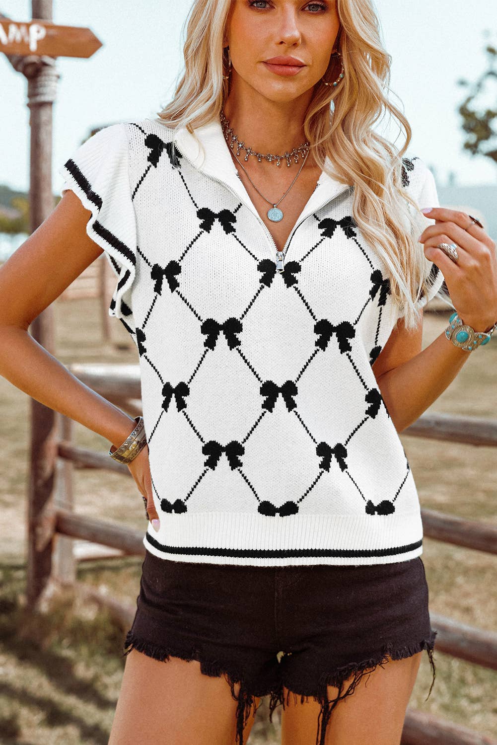 BOUNDARIES BowPrint Zipped Collar Sweater Top
