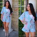 Blue blush ENTRANCED LeafPrint V-Neck TieWaist RuffleHem Short Romper
